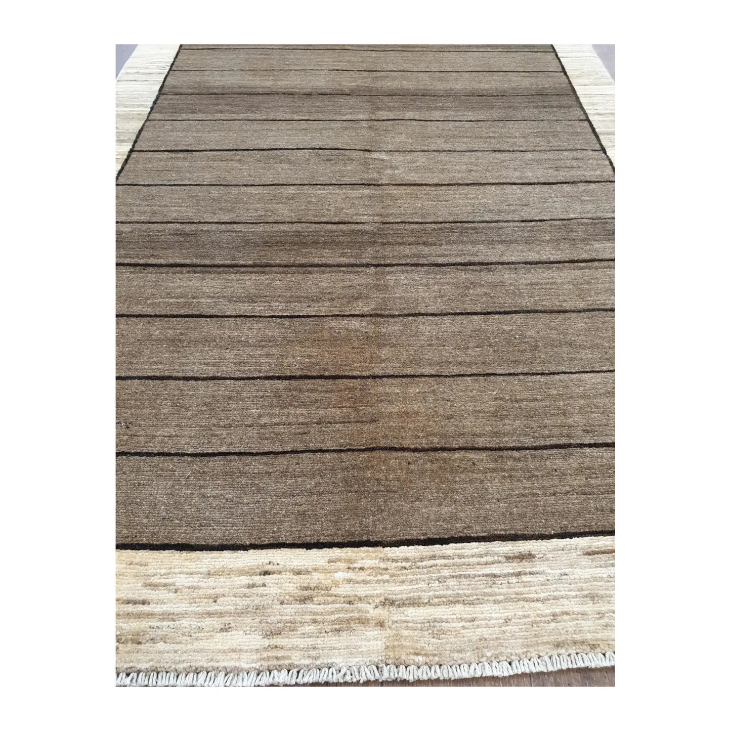 Close-up of Afghan Gabbeh wool rug showing hand-knotted pile, tonal brown field and cream border detail, 166 x 106 cm