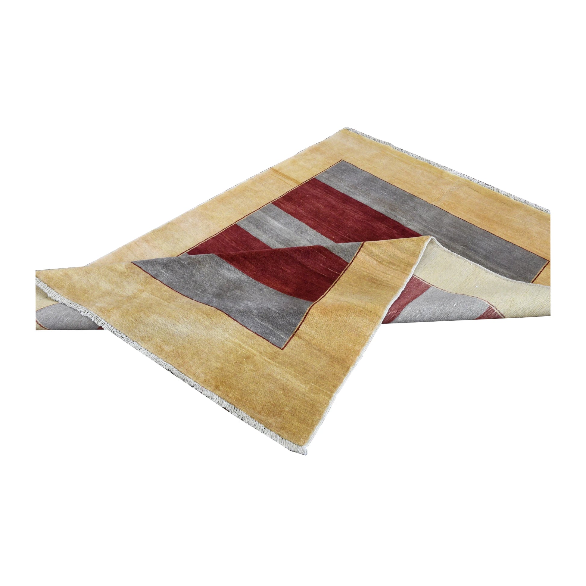 Folded view of Afghan Gabbeh hand-knotted wool rug showing its striped pile, golden-beige border and fringe