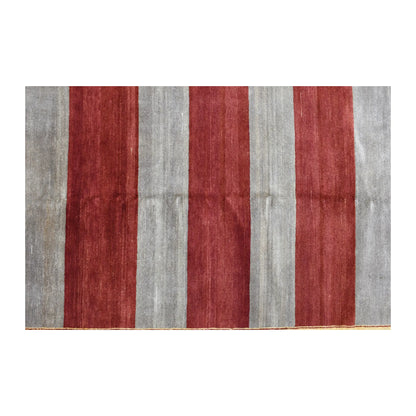 Field detail of Afghan Gabbeh rug showing broad red and grey stripes with gentle tonal variation