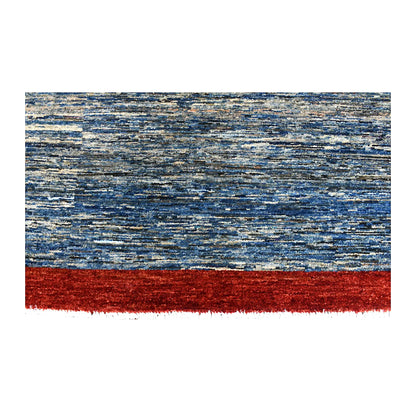 Blue field, red border and fringe detail of Afghan Gabbeh rug with grey and beige tonal striations