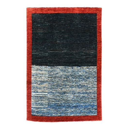 Full view of Afghan Gabbeh hand-knotted wool rug with a deep red border and dark navy and layered blue field, 196 x 157 cm