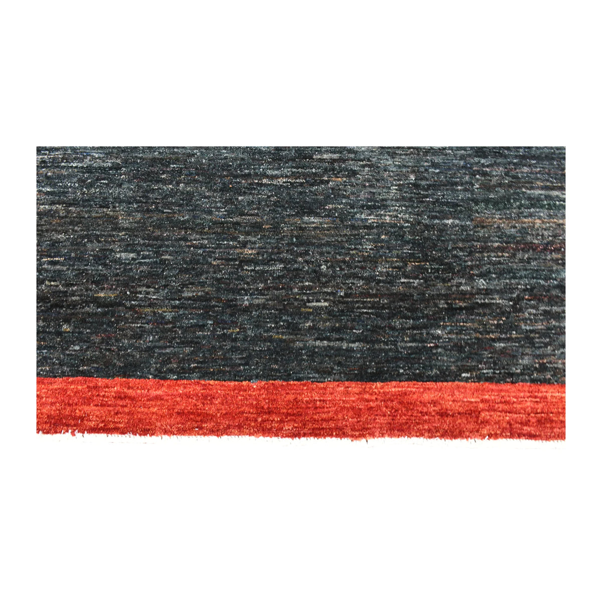 Dark navy field and red border detail of Afghan Gabbeh wool rug with subtle tonal texture