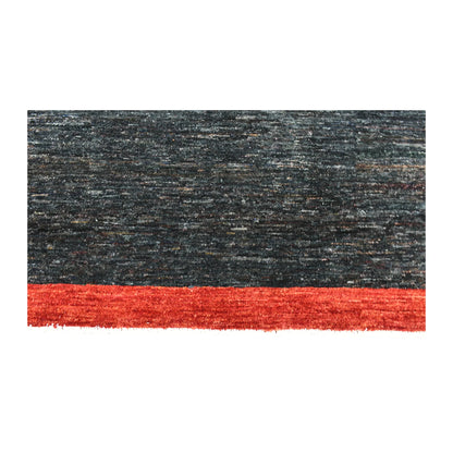 Dark navy field and red border detail of Afghan Gabbeh wool rug with subtle tonal texture