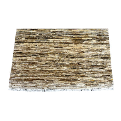 Fringe and end detail of Afghan Gabbeh rug with layered brown, beige and ivory horizontal striations