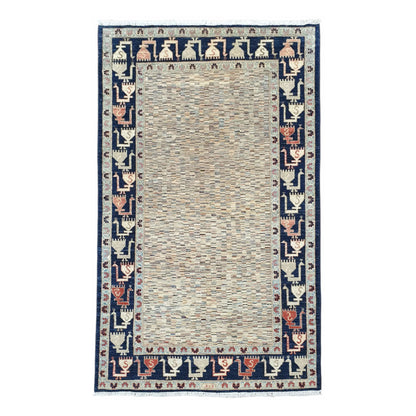 Full view of Afghan Gabbeh hand-knotted wool rug with variegated ivory field and deep navy border, 234 x 142 cm