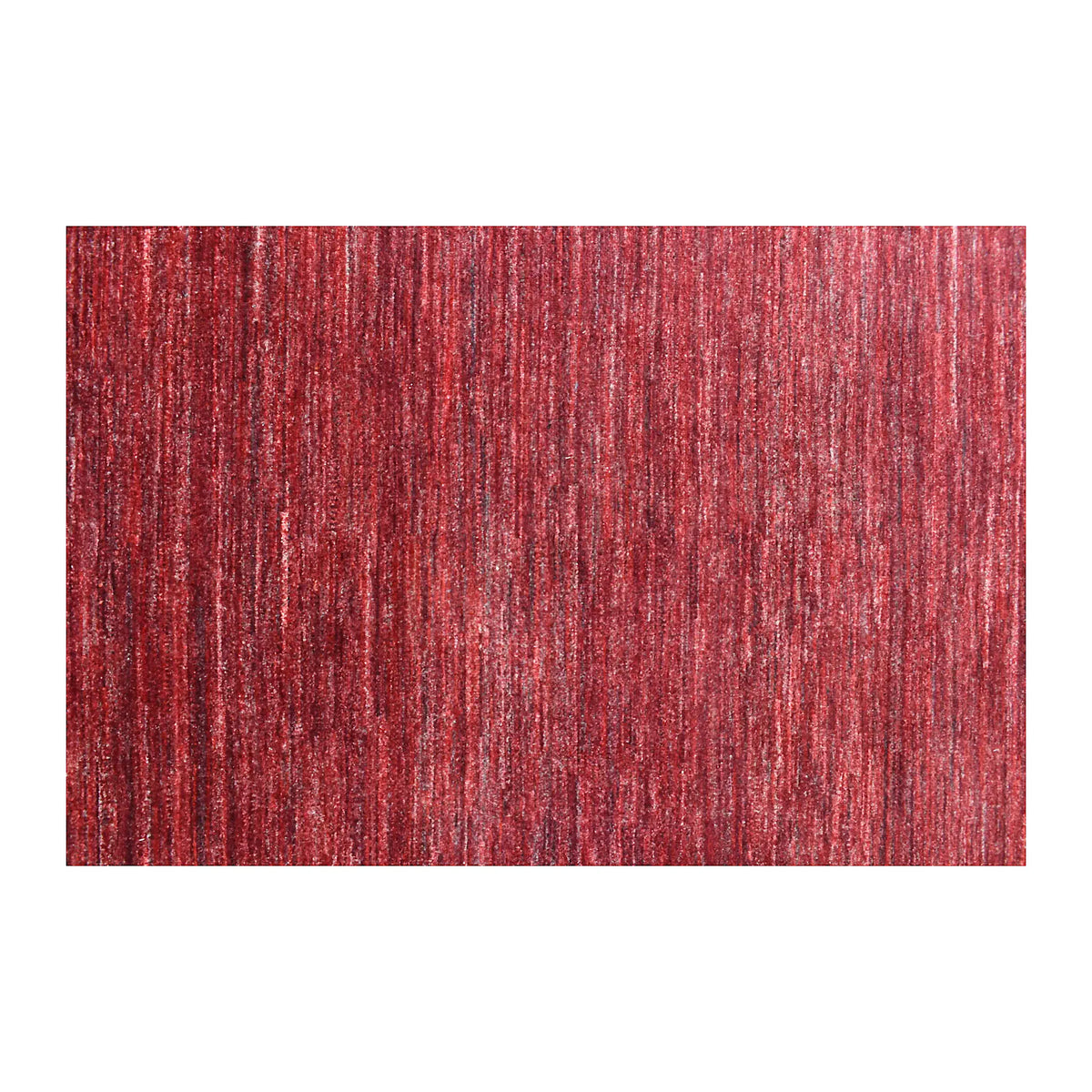 Field detail of Afghan Gabbeh rug showing tonal striations across the deep red wool pile