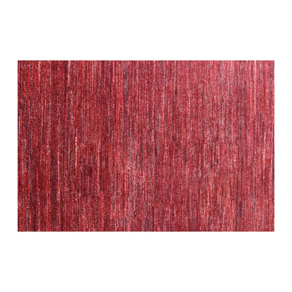 Field detail of Afghan Gabbeh rug showing tonal striations across the deep red wool pile