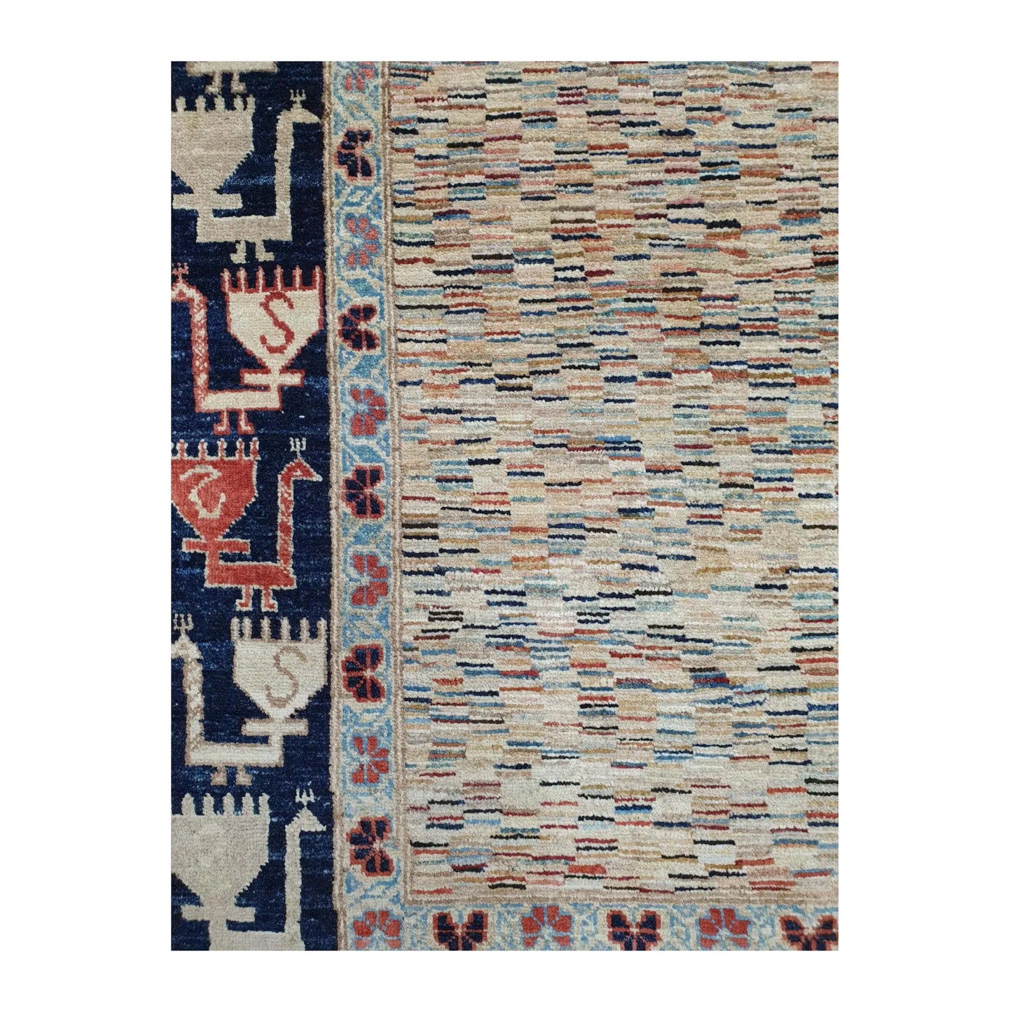 Close-up of Afghan Gabbeh wool rug showing the variegated multicolour field and deep navy side border with stylised motifs