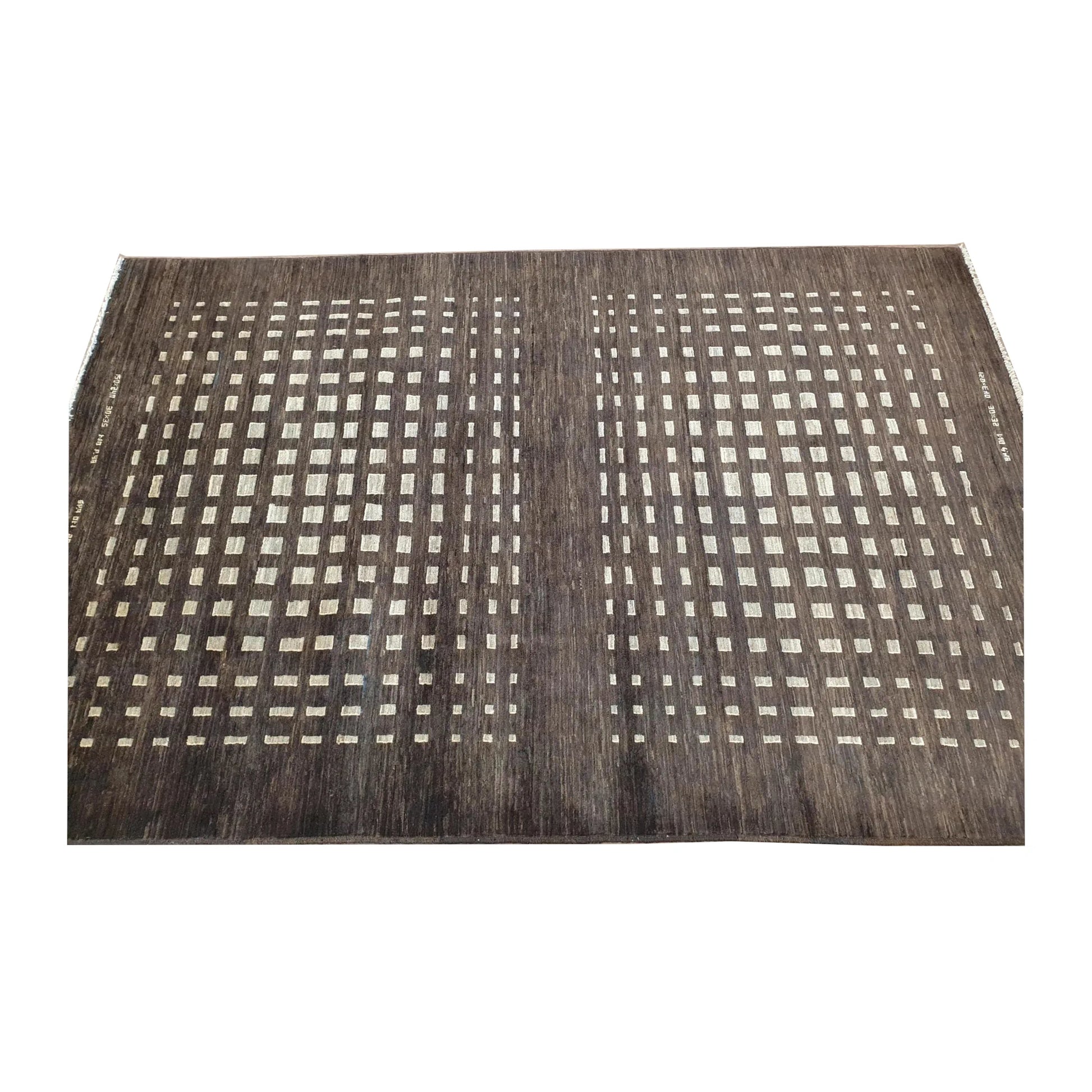 Fringe-end perspective view of Afghan Gabbeh natural wool rug showing the dark brown field and ivory square lattice pattern