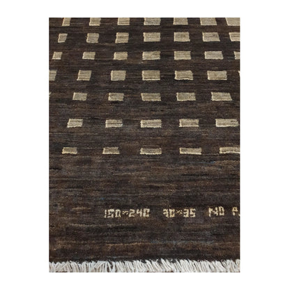 Close-up of Afghan Gabbeh natural wool rug showing the geometric lattice pattern, tonal wool texture and fringe