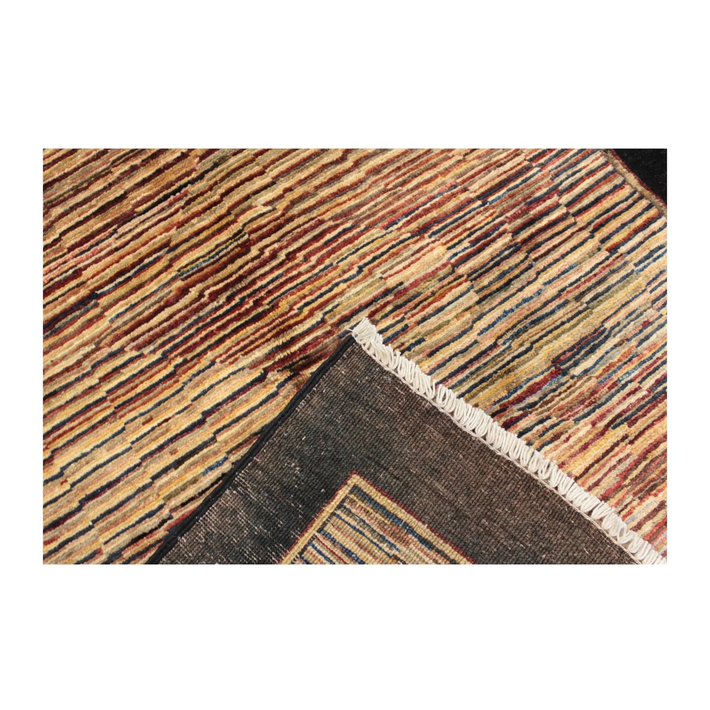 Folded-corner detail of Afghan Gabbeh wool rug showing pile and reverse weave, 153 x 98 cm