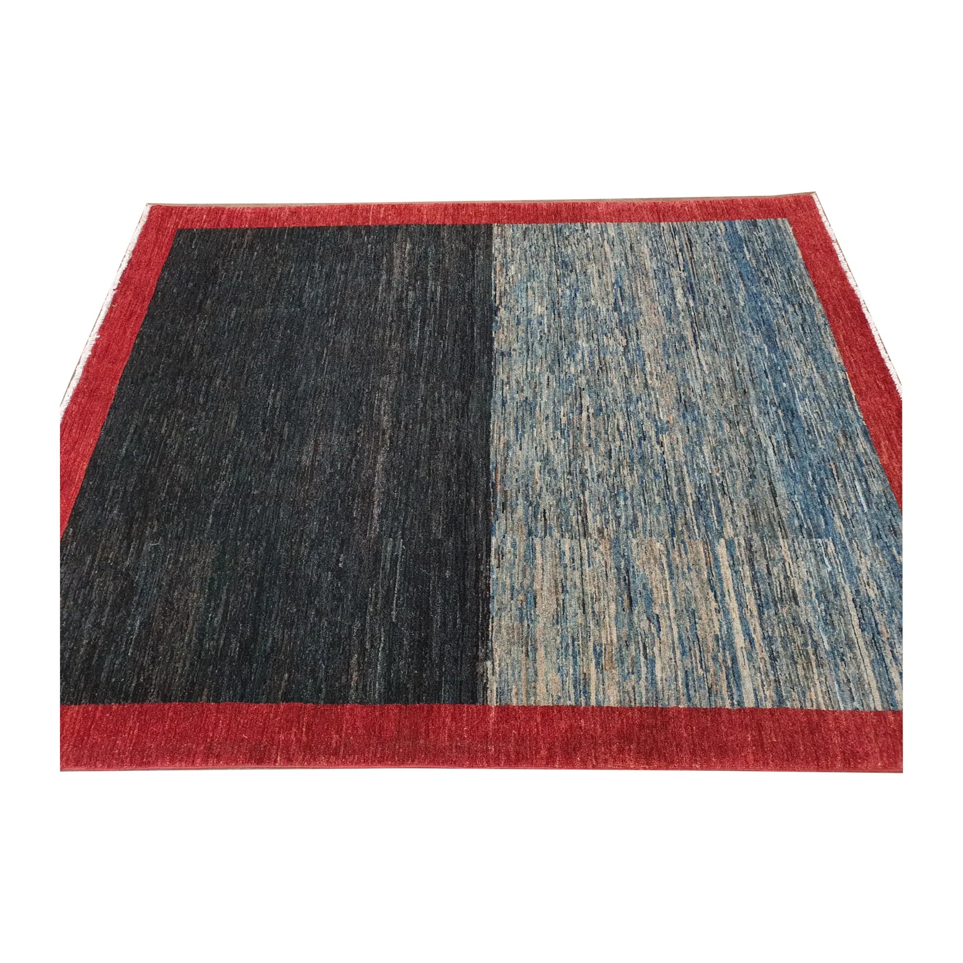 Angled view of Afghan Gabbeh wool rug with dark navy and blue field, 196 x 157 cm