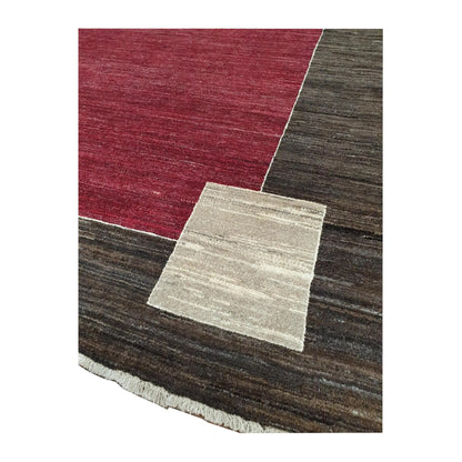Corner and fringe detail of Afghan Gabbeh wool rug showing off-white corner motif and charcoal-brown border, 243 x 162 cm