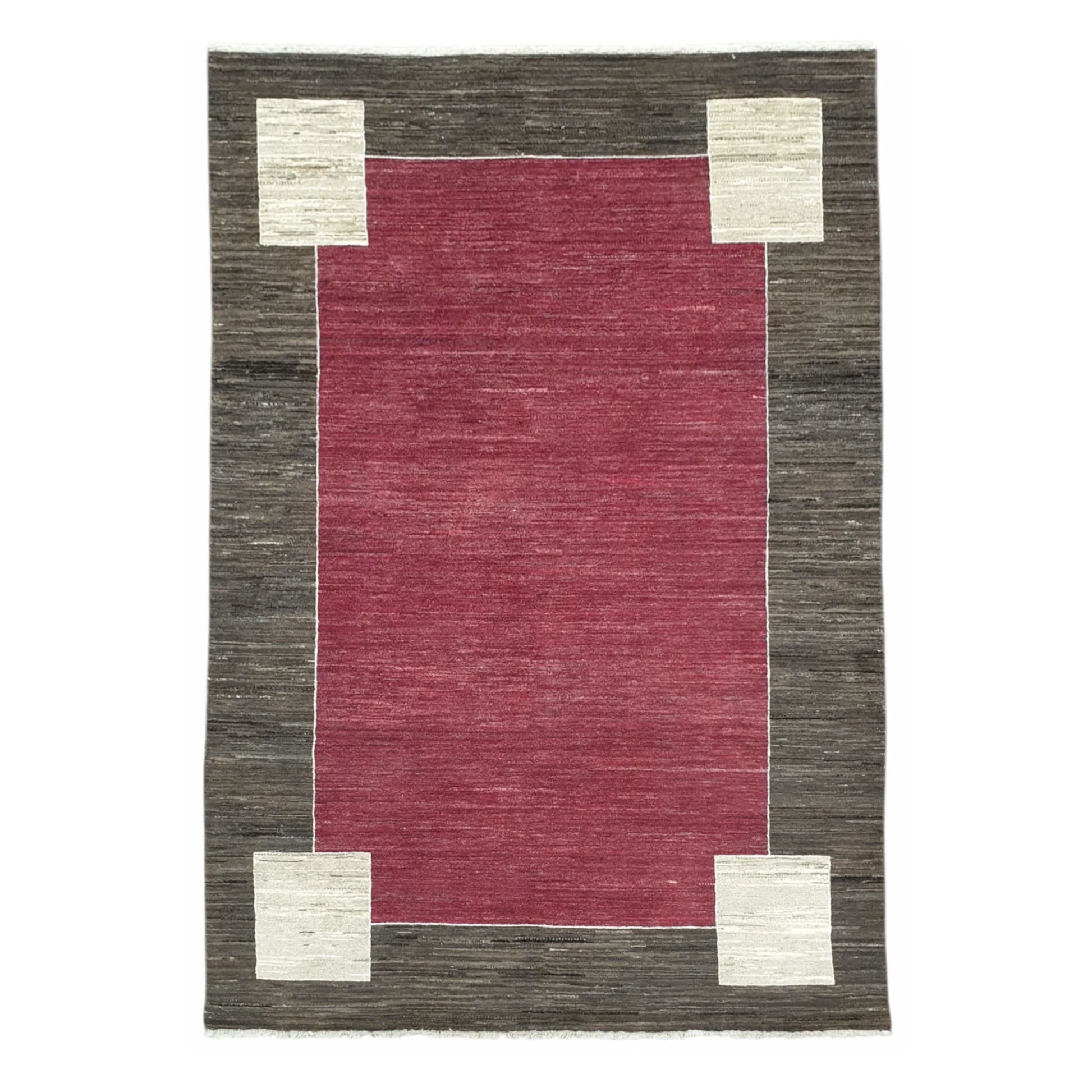 Full view of Afghan Gabbeh hand-knotted wool rug with red field, charcoal-brown border and off-white corner motifs, 243 x 162 cm