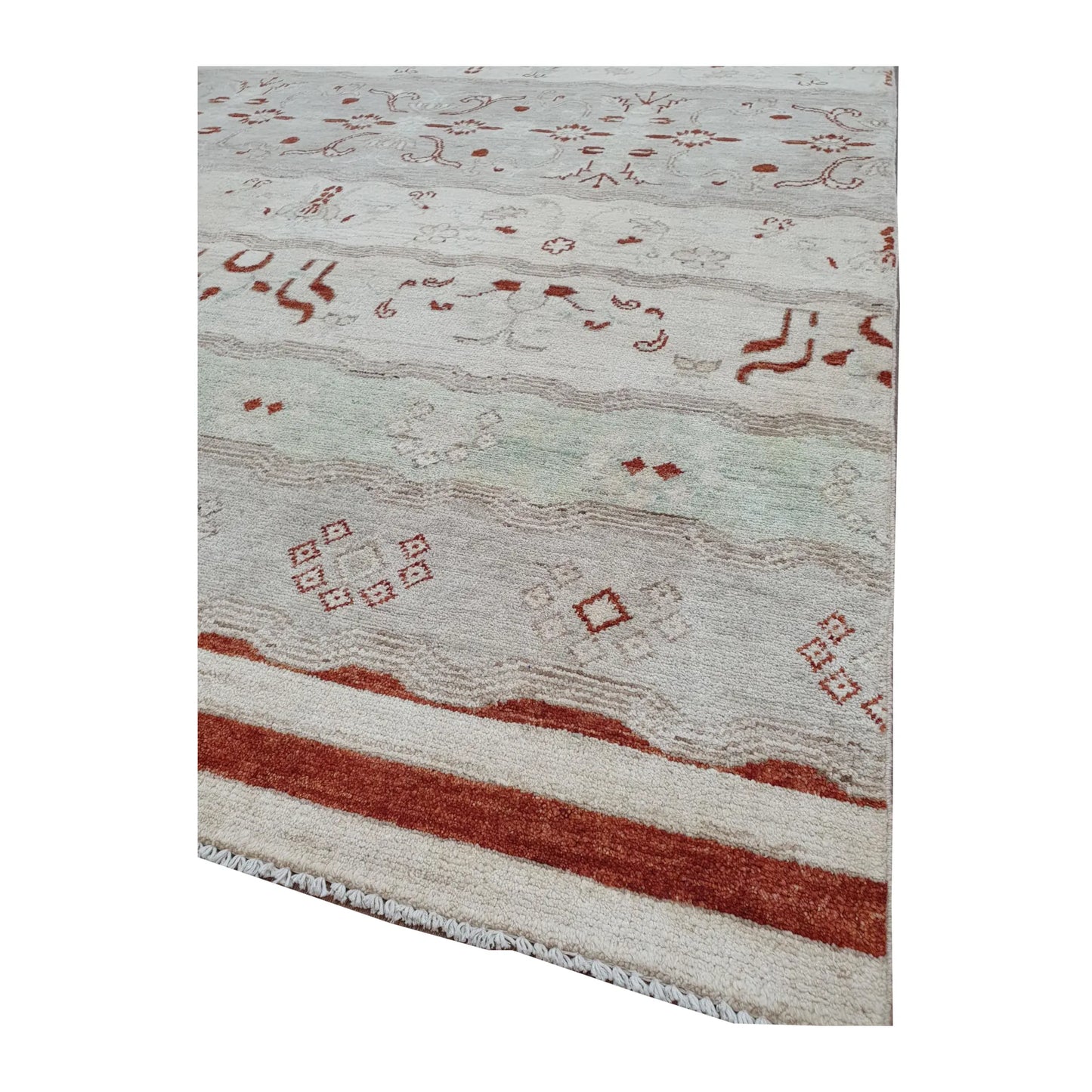 Angled end-border and fringe detail of Afghan Gabbeh wool rug showing rust-red border bands, soft tonal pattern and wool fringe, 250 x 168 cm