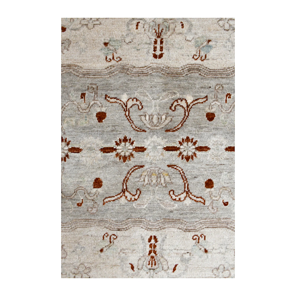 Central motif detail of Afghan Gabbeh wool rug showing rust-red floral forms and subtle tonal striations