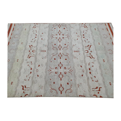 Centre-field detail of Afghan Gabbeh hand-knotted wool rug showing symmetrical rust-red motifs and subtle tonal variation, 250 x 168 cm