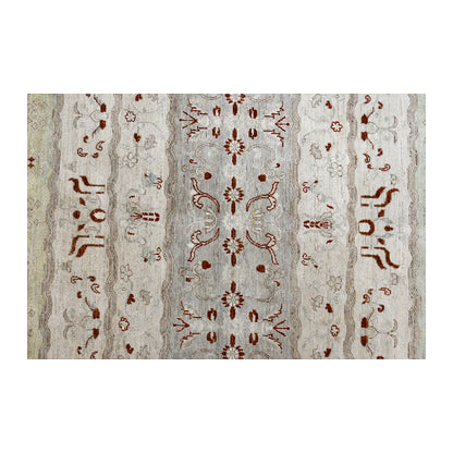 Centre-field detail of Afghan Gabbeh wool rug showing symmetrical rust-red floral motifs across tonal off-white bands