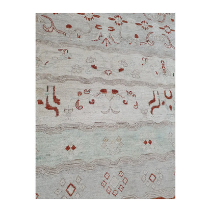 Lower-field pattern detail of Afghan Gabbeh wool rug showing pale mint band, rust-red motifs and geometric accents, 250 x 168 cm