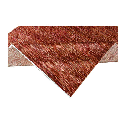 Folded corner of Afghan Gabbeh rug showing the tonal face, reverse weave and side finishing