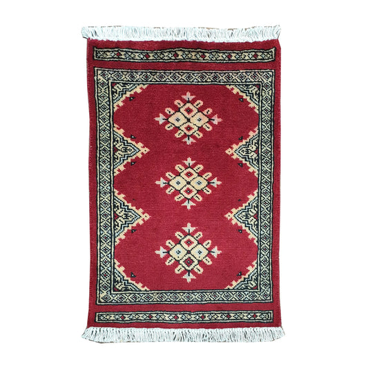 Afghan Jaldar wool rug 65 x 46 cm full view with red field, ivory diamond motifs and fringe