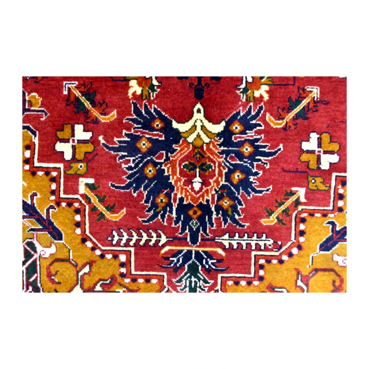 Field detail of Afghan Karghai rug showing a dark-blue floral motif against deep red with golden-ochre sections