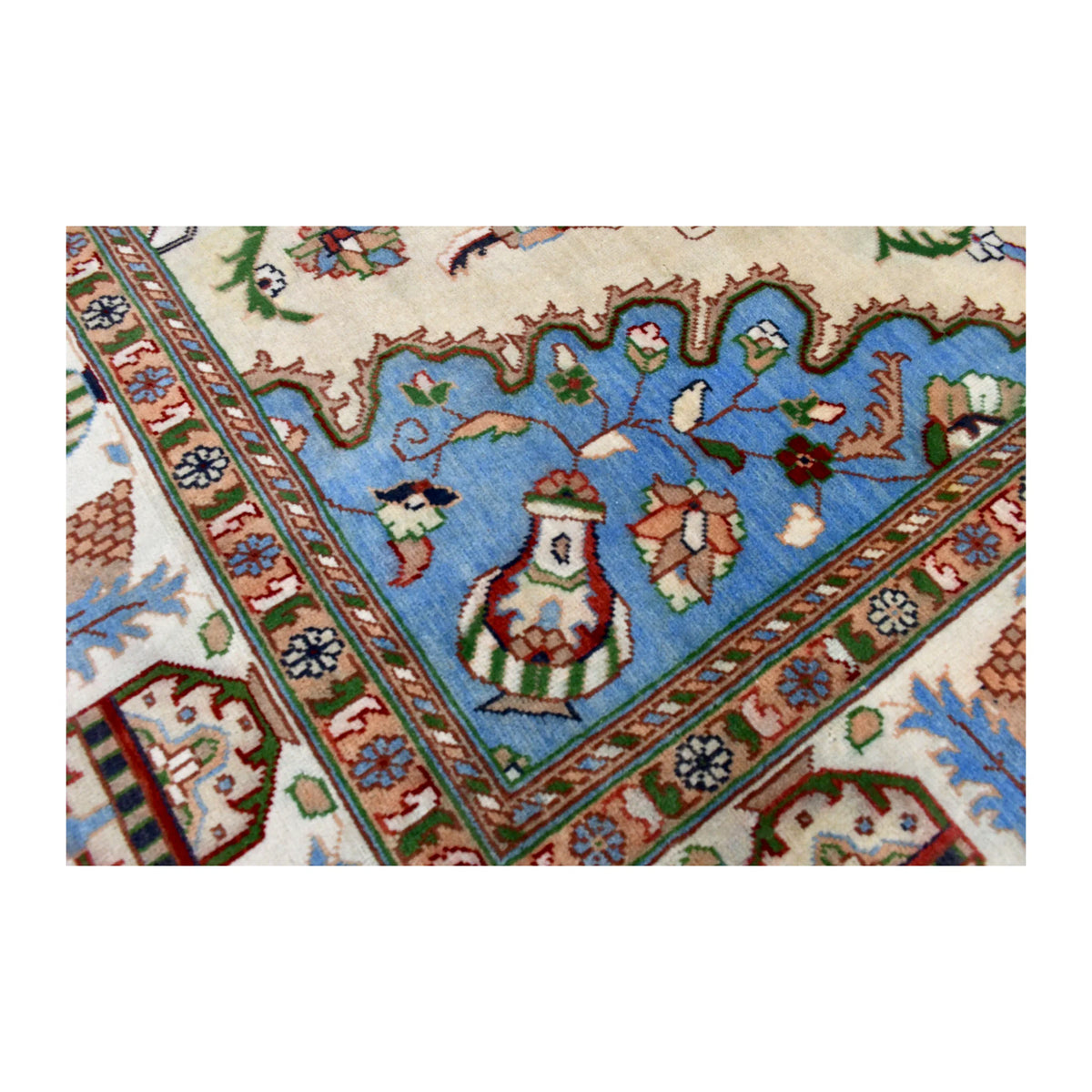 Pale blue corner with a vase motif and layered floral border on the Afghan Karghai rug