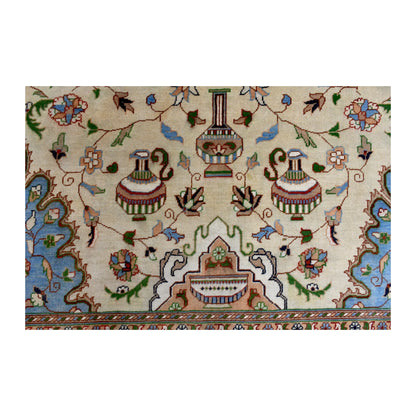 Vase-inspired motifs and small flowers across the beige field of the Afghan Karghai wool rug