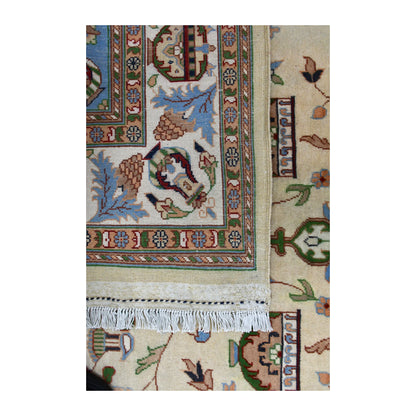 Folded-corner detail showing the Afghan Karghai rug’s paler patterned reverse, white fringe and floral front