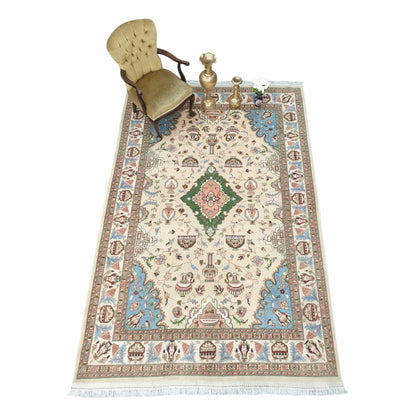 Lifestyle view of Afghan Karghai wool rug with beige field and blue-green borders, 298 x 202 cm