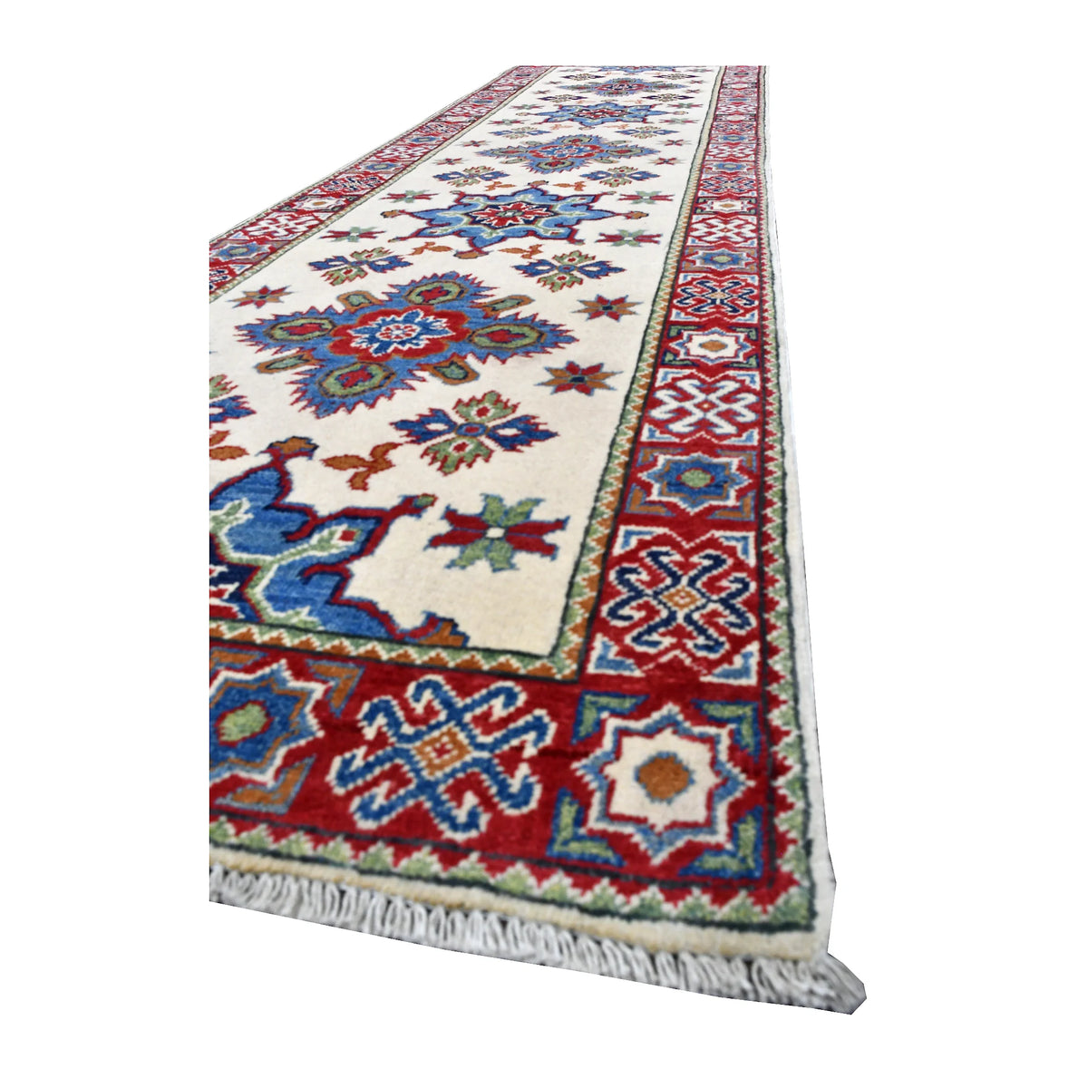 Angled view of Afghan Kazak runner showing its cream medallion field, red and blue patterned border and white fringe