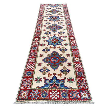 Full view of Afghan Kazak hand-knotted wool runner with cream field, blue and red medallions and geometric borders, 300 x 80 cm
