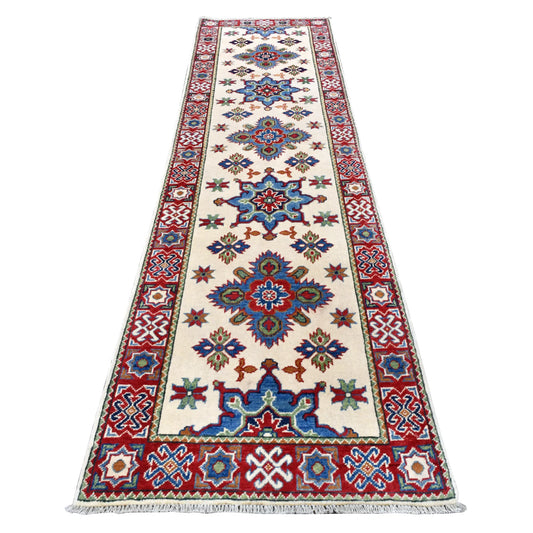 Full view of Afghan Kazak hand-knotted wool runner with cream field, blue and red medallions and geometric borders, 300 x 80 cm