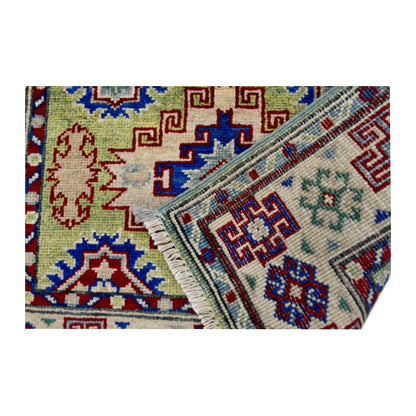 Folded corner reverse-weave detail of Afghan Kazak hand-knotted wool rug showing the back structure, pattern and weave