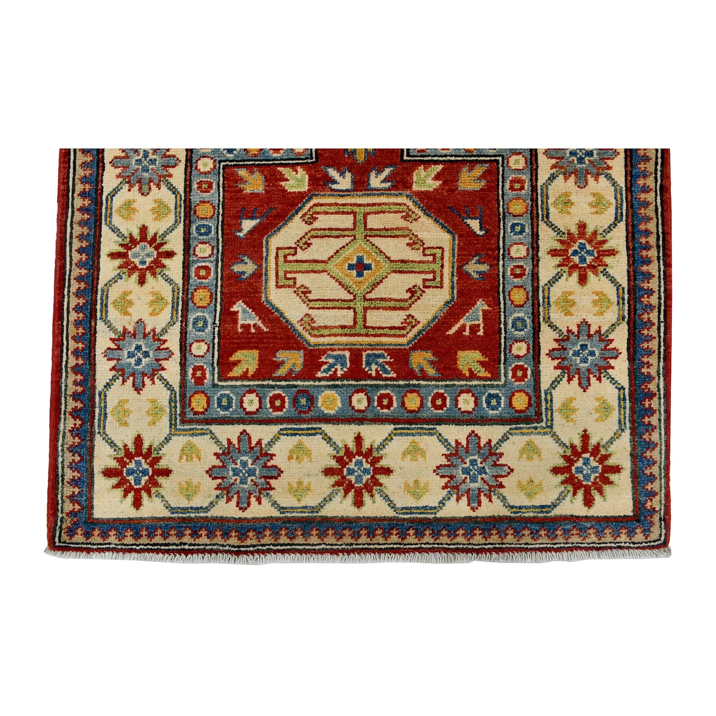 End field and border detail of Afghan Kazak wool rug showing cream ground, red motifs, blue accents and patterned border
