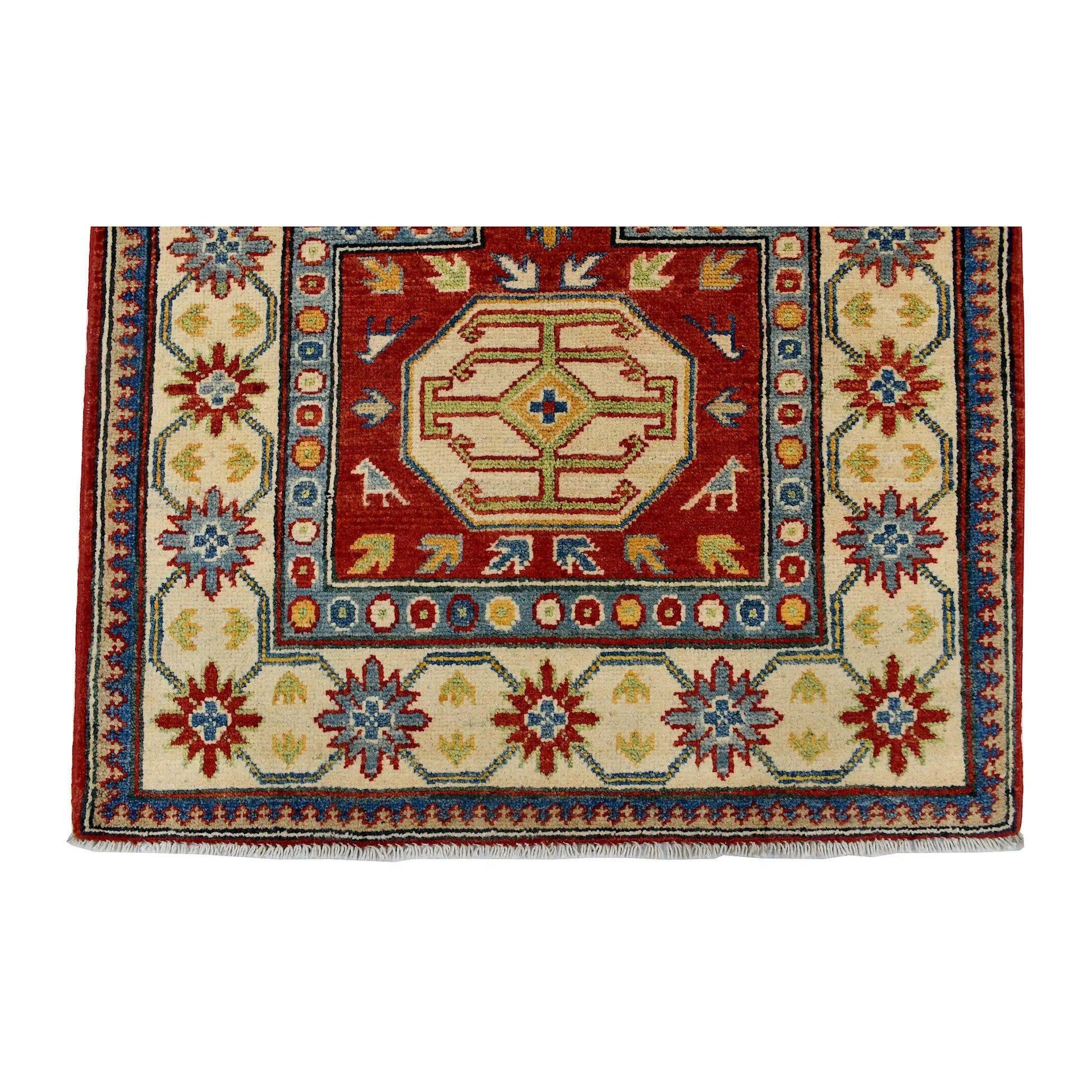 End field and border detail of Afghan Kazak wool rug showing cream ground, red motifs, blue accents and patterned border