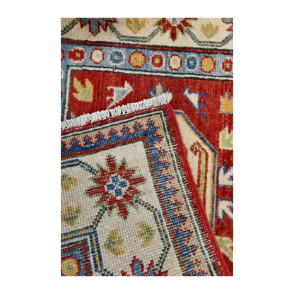 Folded corner reverse-weave detail of Afghan Kazak hand-knotted wool rug showing the back structure, pattern and weave