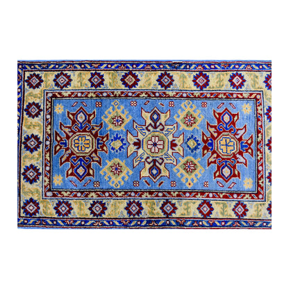 Full design detail of Afghan Kazak hand-knotted wool rug showing three medallions, light blue field and detailed border