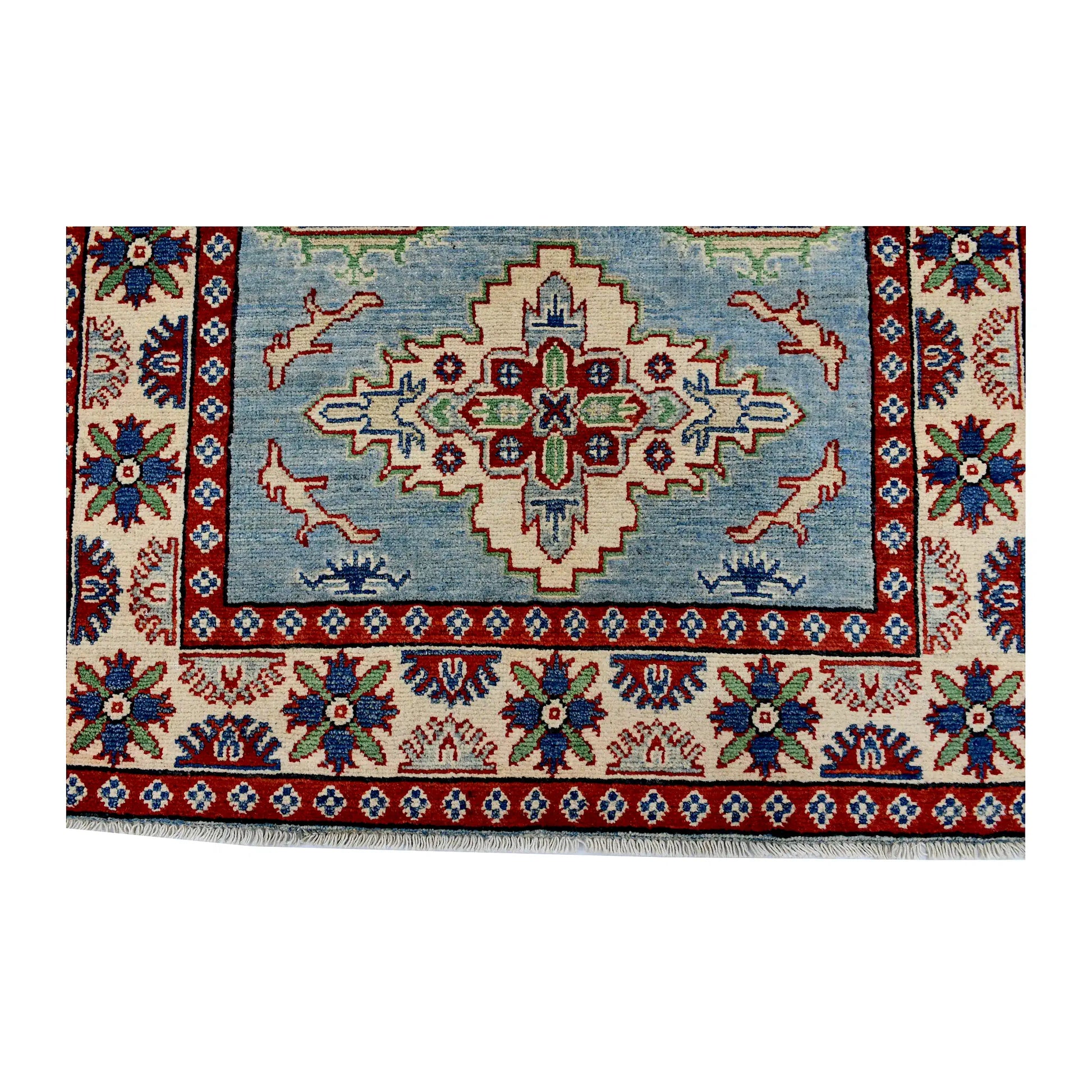Field and border detail of Afghan Kazak hand-knotted wool rug showing light blue ground, stepped medallion and patterned border