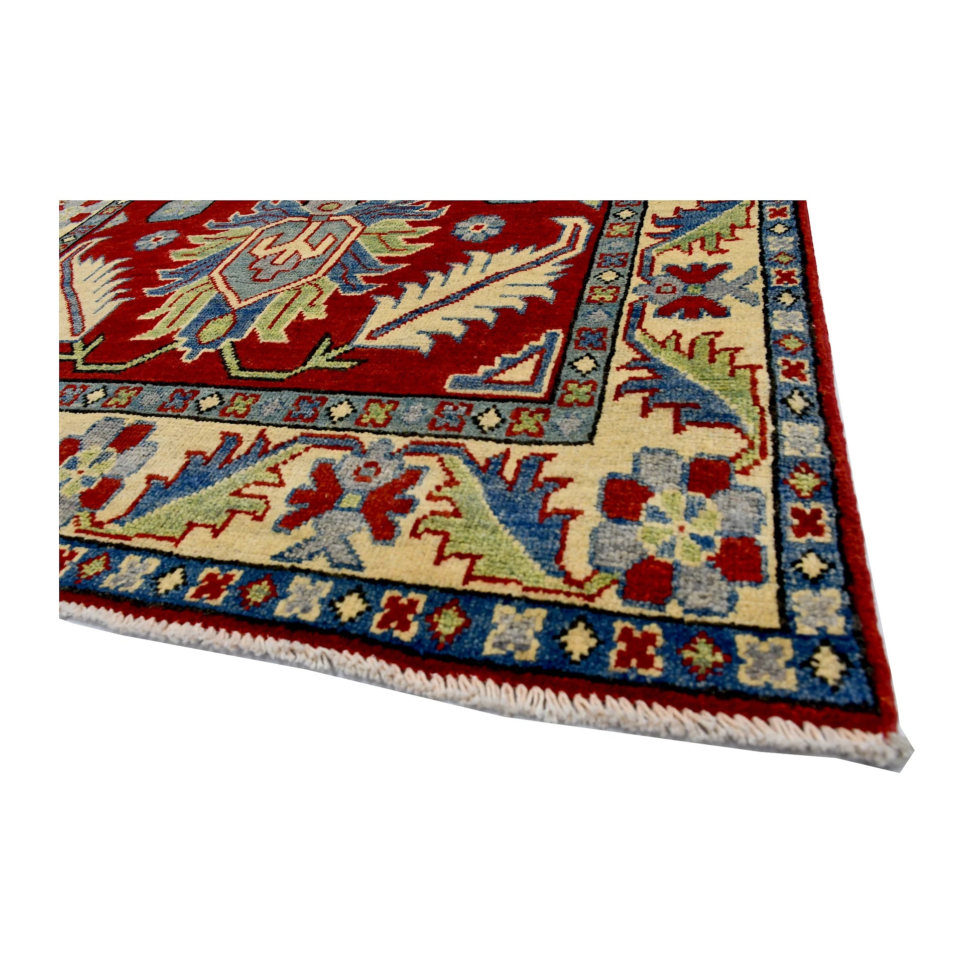 Angled corner and border view of Afghan Kazak wool rug showing red field, cream border and light blue accents