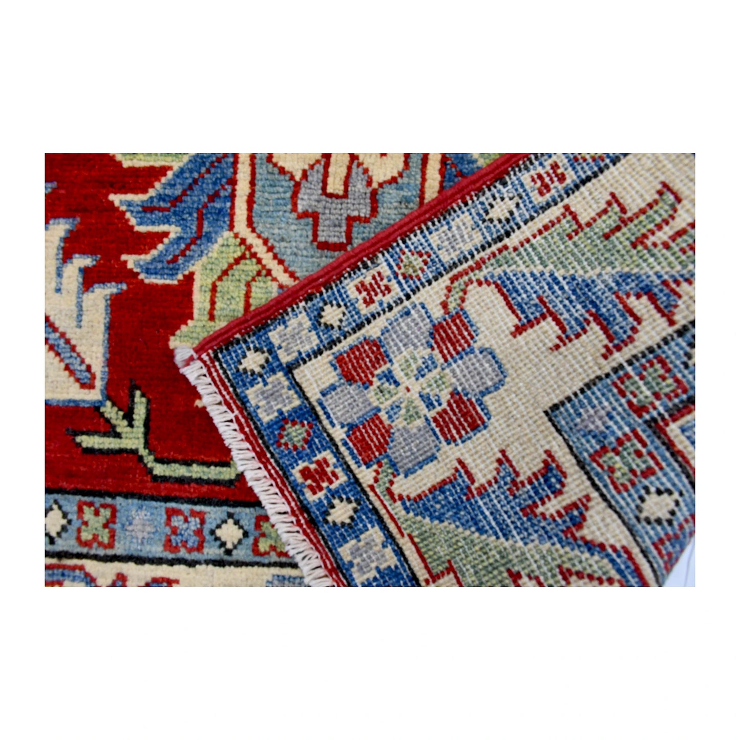 Folded corner reverse-weave detail of Afghan Kazak hand-knotted wool rug showing the back structure, pattern and weave