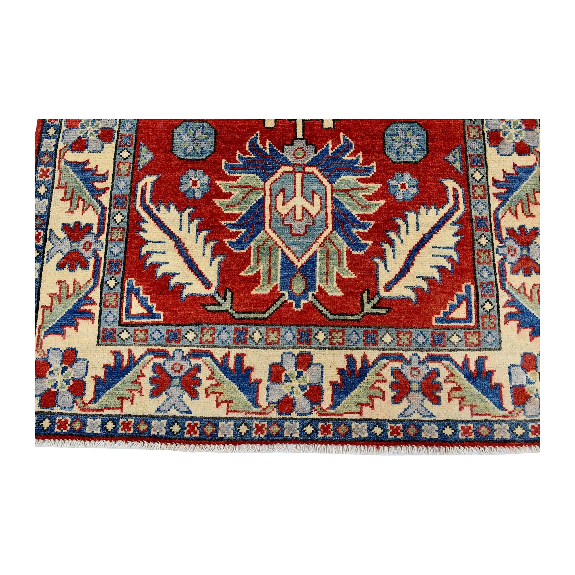 End medallion and border detail of Afghan Kazak hand-knotted wool rug showing red field, cream border and light blue accents
