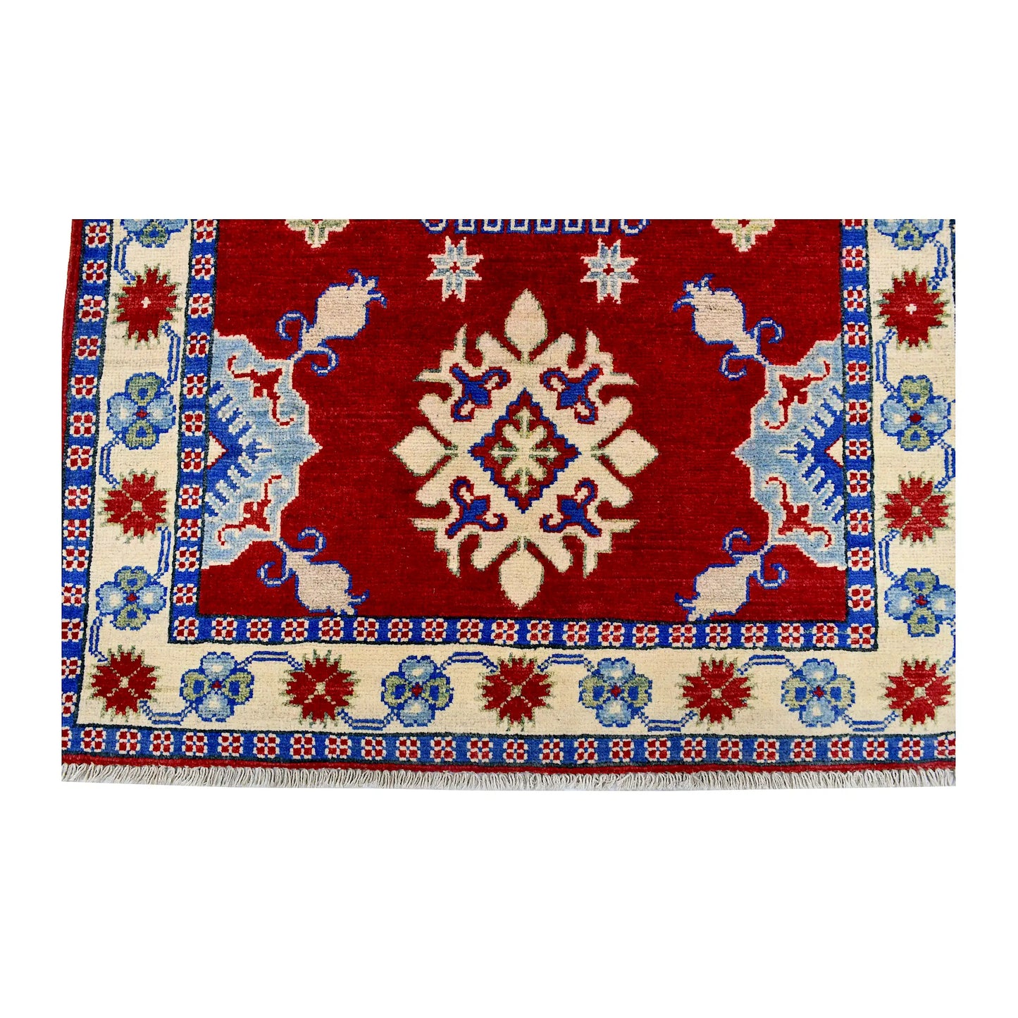 End field and border detail of Afghan Kazak hand-knotted wool rug showing red field, cream border and light blue accents