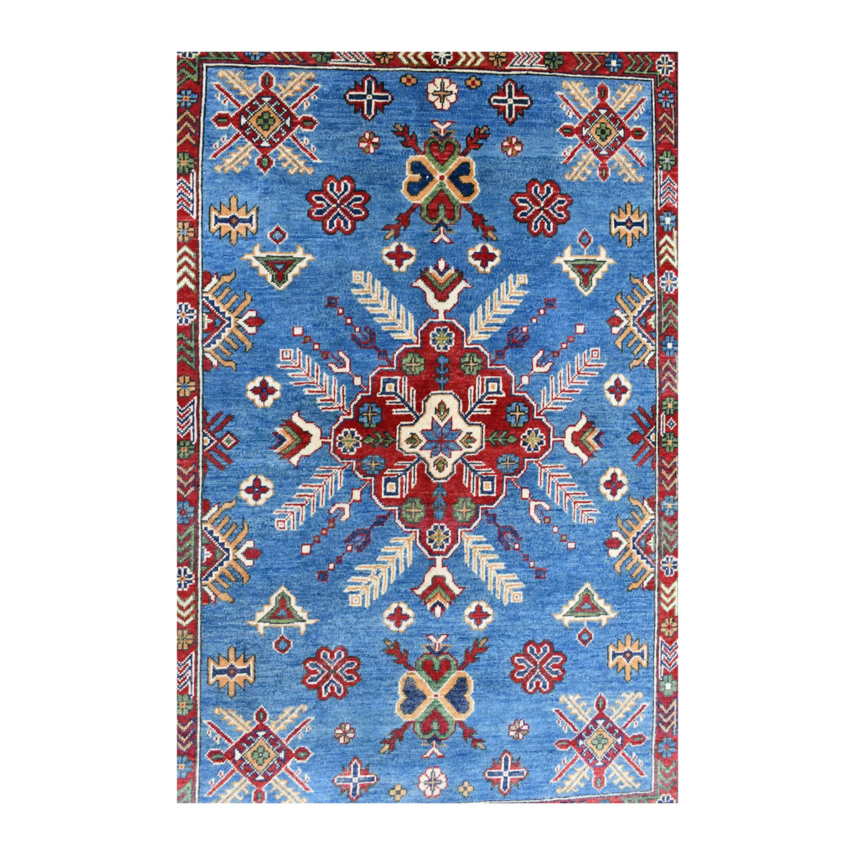 Field detail of Afghan Kazak rug showing the red star medallion and scattered geometric motifs on a sky-blue ground