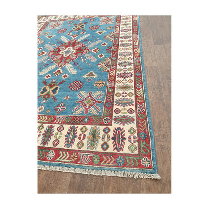 Border and fringe detail of Afghan Kazak hand-knotted wool rug with cream and red pattern