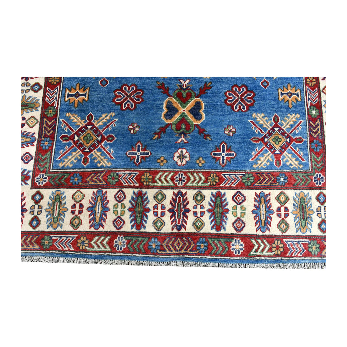 Fringe and end-border detail of Afghan Kazak rug with ivory ground and red, green, navy and ochre motifs