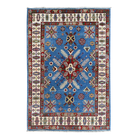 Full view of Afghan Kazak hand-knotted wool rug with sky-blue field, red star medallion and ivory border, 204 x 156 cm
