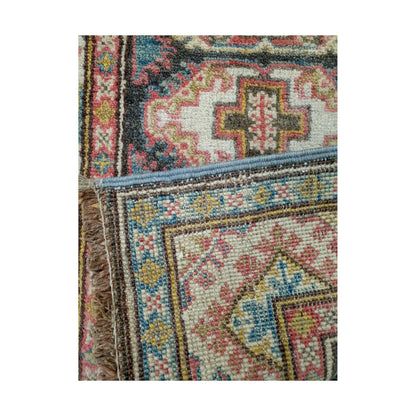 Folded corner reverse-weave detail of Afghan Kazak hand-knotted wool rug showing back structure, border pattern and weave
