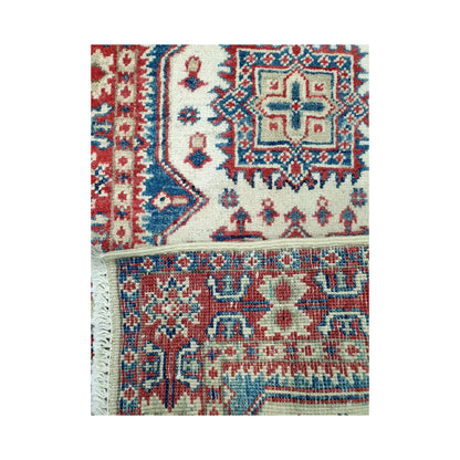 Folded corner reverse-weave detail of Afghan Kazak hand-knotted wool rug showing back structure, border pattern and weave