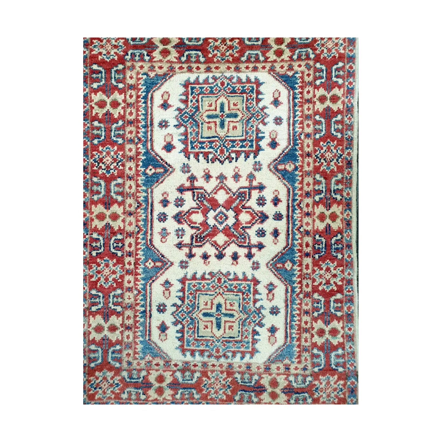 Front design view of Afghan Kazak hand-knotted wool rug showing three geometric medallions, cream central field and patterned red border
